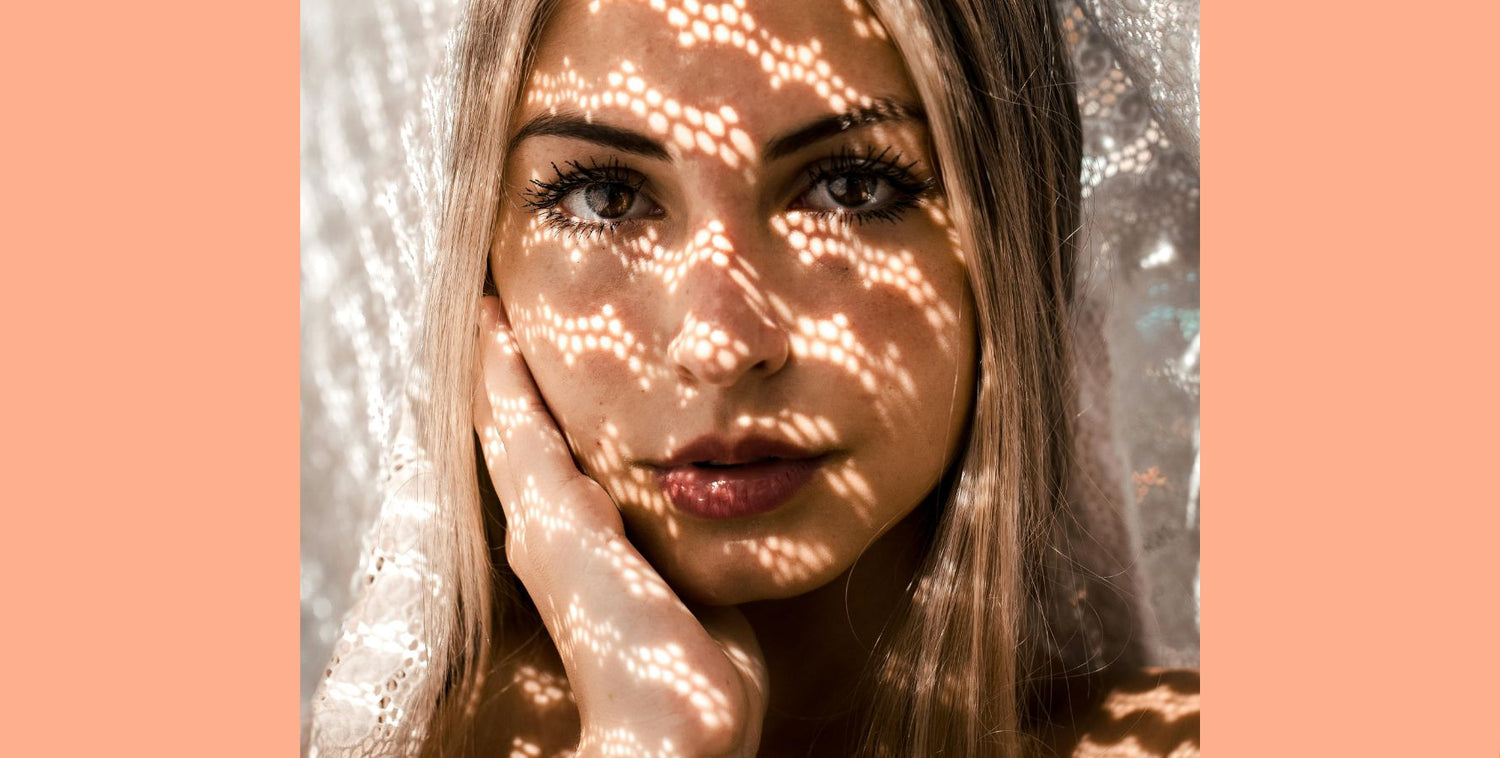 CERM Skin: Skin aging - Why collagen and elastin matter. Woman with shadow pattern on face. Image: Pexels.com/Lola Russian
